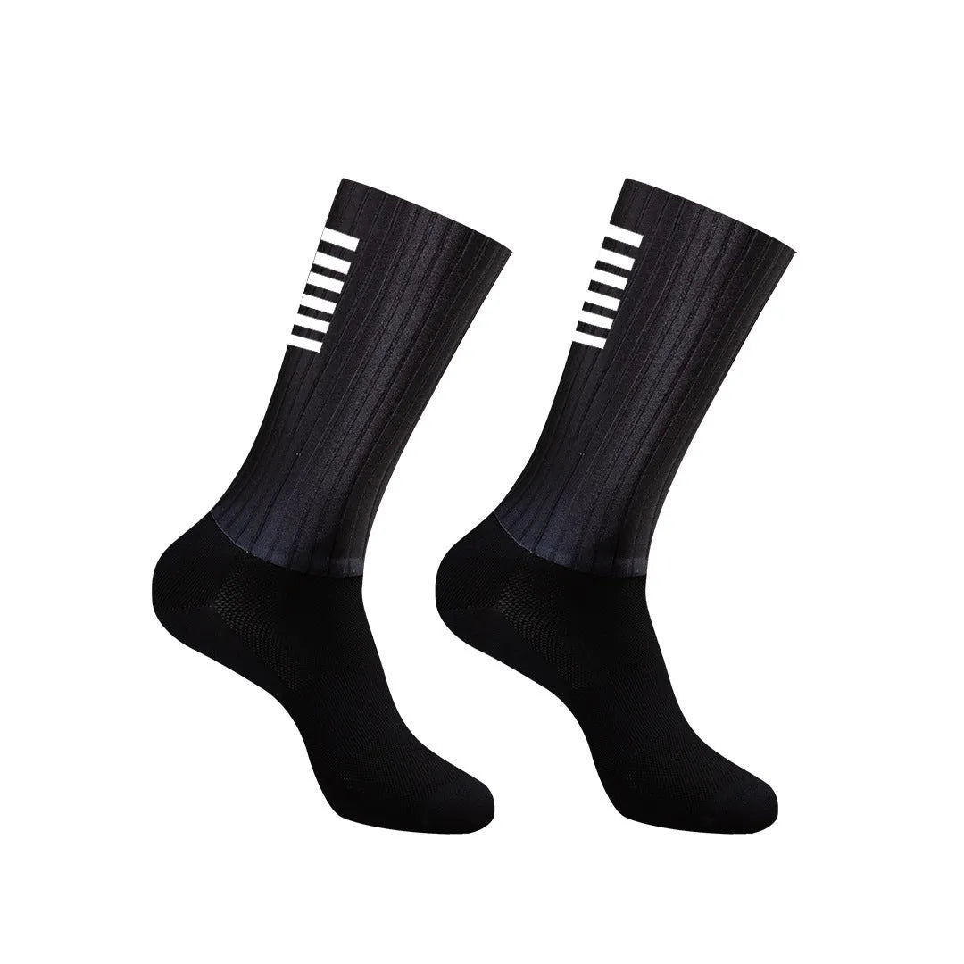 Cycling and running socks in chemical fibre blend fabric shown in orange, black, purple, white, grey, and dark blue colours.