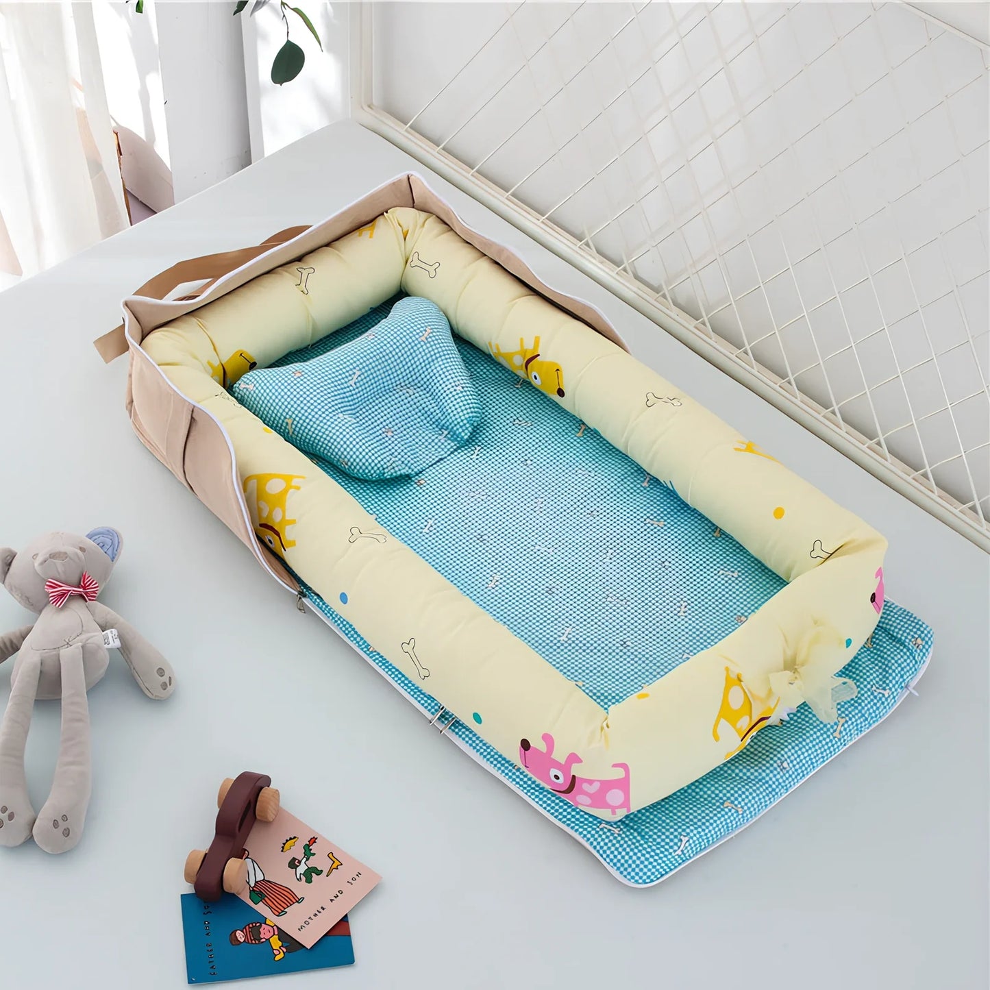 Foldable cotton portable baby crib in Animal World Blue, 90x50 cm with pillow and strap, weighing 1.3 kg