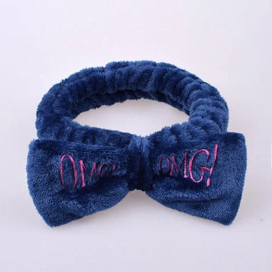 Coral velvet butterfly end hair band in pink with text styling, showing butterfly ends and cloth material