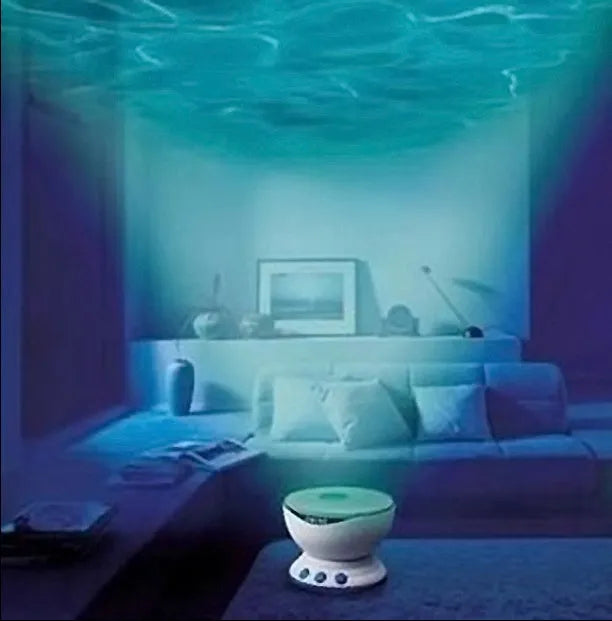 Blue ocean themed LED projection lamp for children's rooms on a shelf.