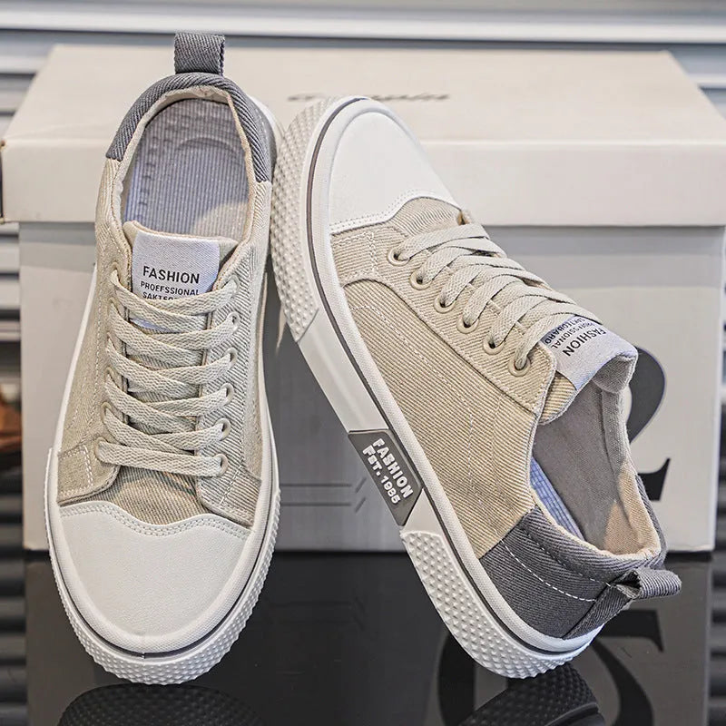 Men's blue canvas casual shoes with round toe and lace-up front, showing PVC sole detail