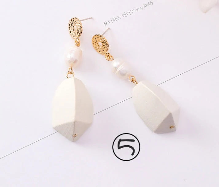 Vintage geometric pearl asymmetric earrings with 925 silver hooks, perfect for adding elegance to any outfit.