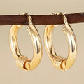 Geometric copper ring ear clip for women in a golden colour.