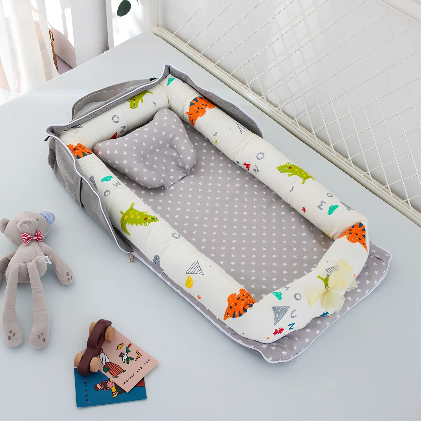 Foldable cotton portable baby crib in Animal World Blue, 90x50 cm with pillow and strap, weighing 1.3 kg