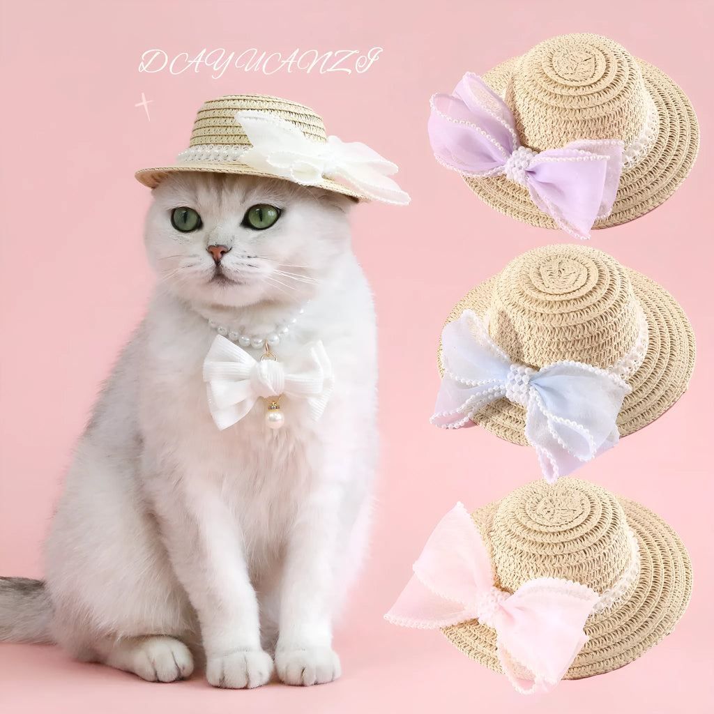 Pink pearl bow straw hat for a cat on a mannequin head, showing Lafite leaf weave and butterfly detail.
