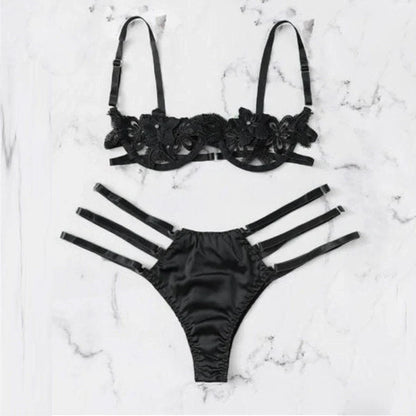 Women's black floral half-cup bra and brief set with fitted straps and back closure