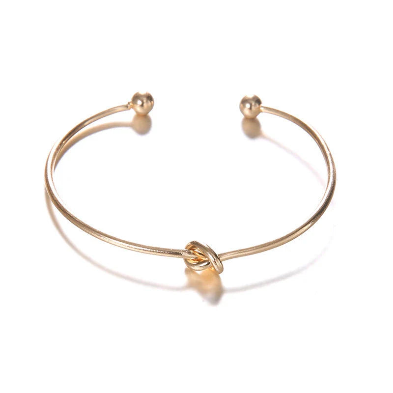 Women's Vintage Cuff Arrow Knotted Bracelet in gold, unique design