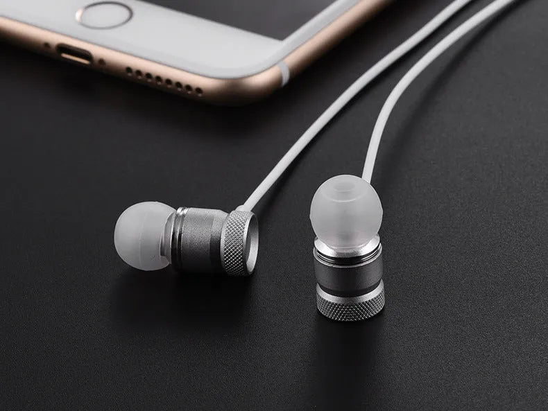 Black, gold, pink, and silver in-ear headphones with TPE cable