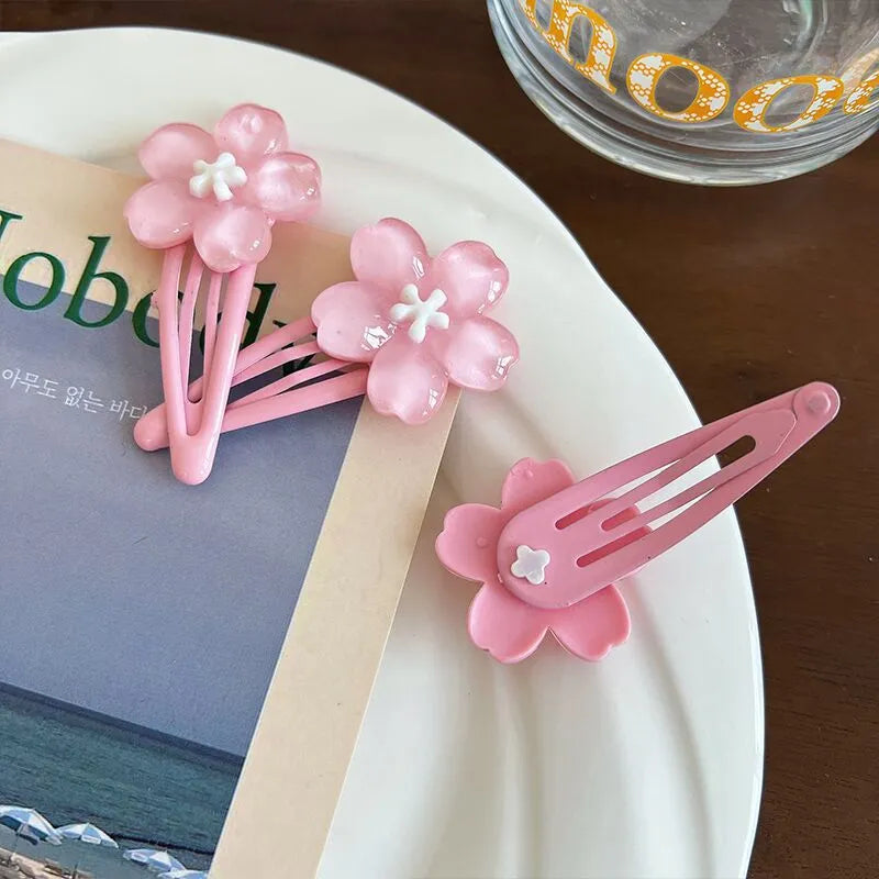 Handmade acrylic cherry blossom hair clip in pink floral design for women