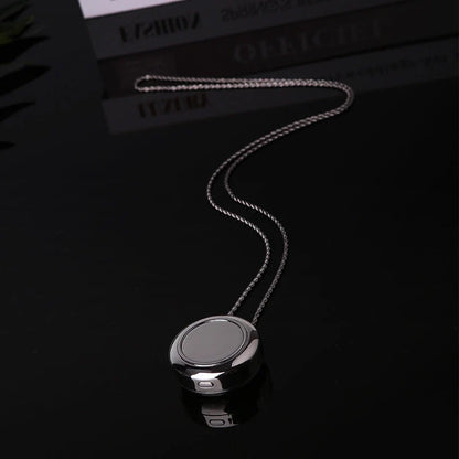 Portable negative ion air purifier necklace in blue, white, and silver options