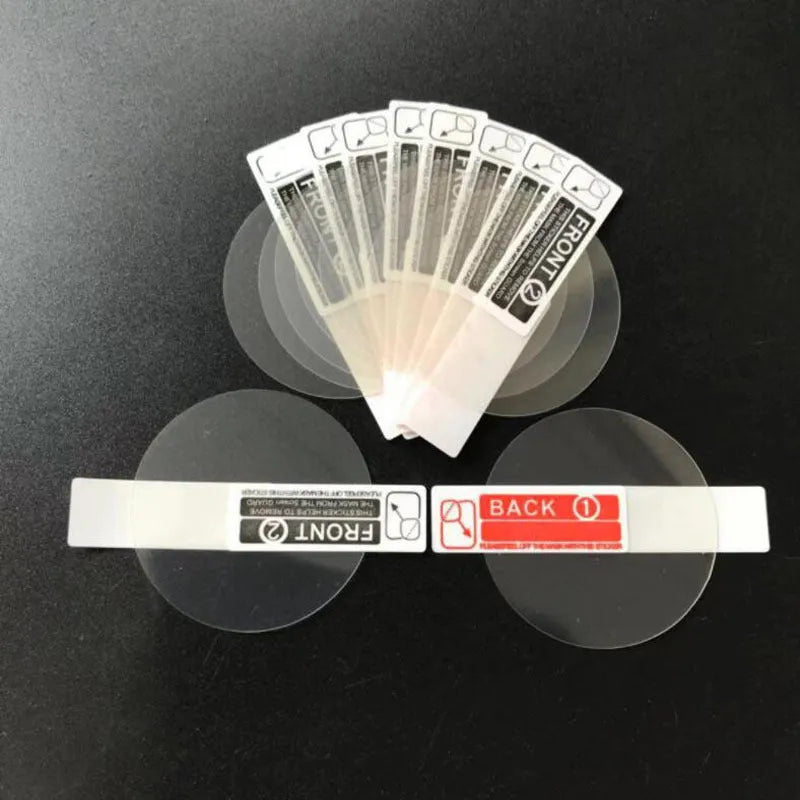 Three transparent PET screen protector films for Ticwatch2 smartwatch on a clean surface.