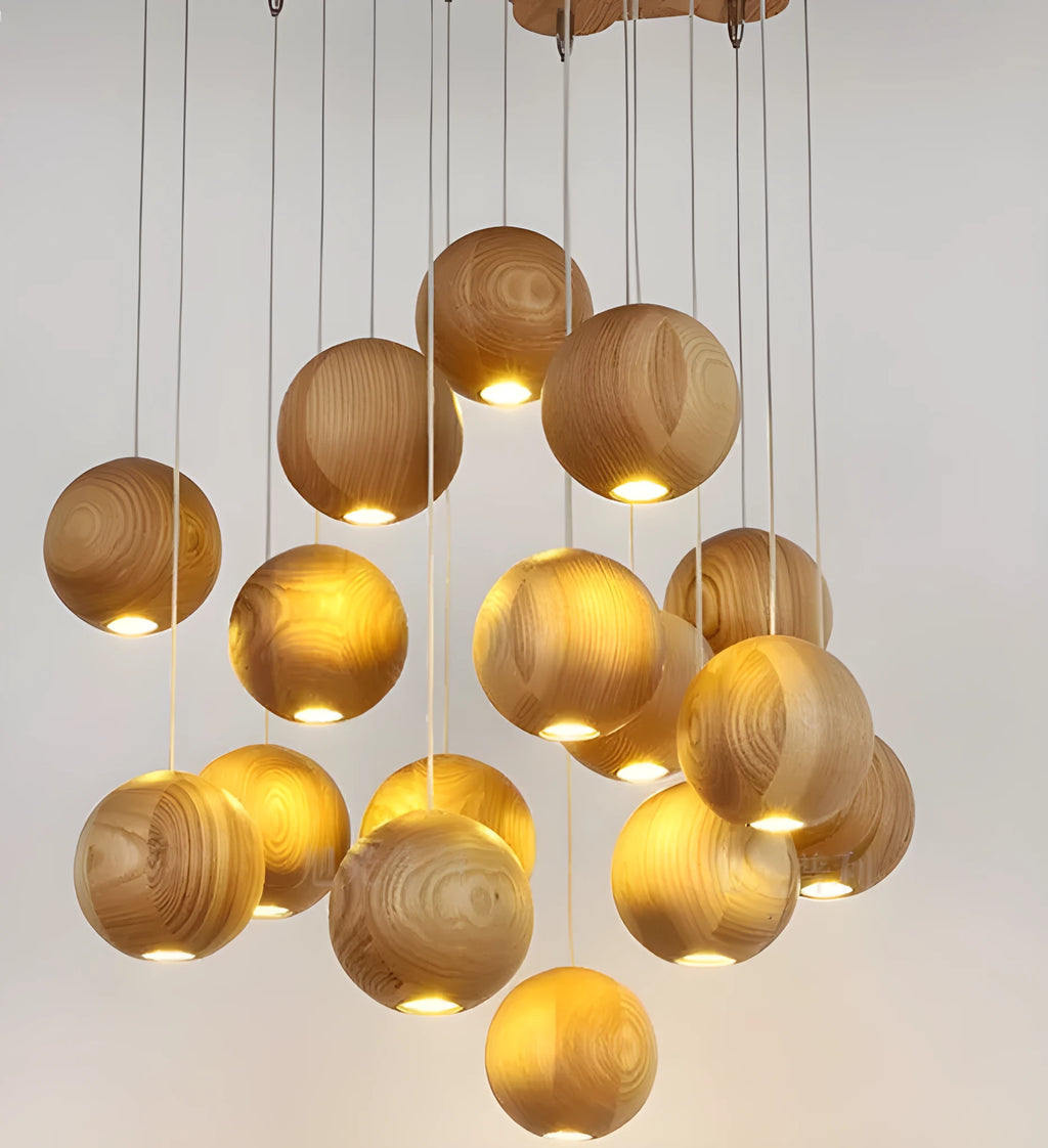 Nordic style solid wood ball chandelier hanging from a ceiling with an adjustable cord.