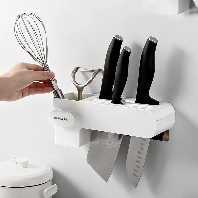 White plastic kitchen knife rack mounted on wall with dimensions 10.6 cm wide by 26 cm tall