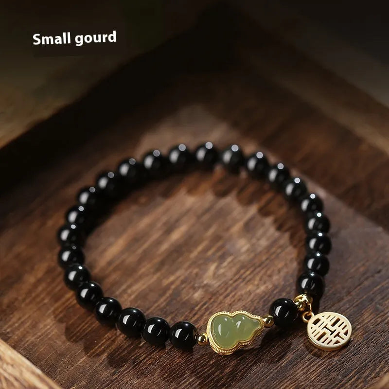 Black obsidian and white Hetian jade gourd bracelet with geometric pattern in 6mm, 8mm, and 10mm size options.