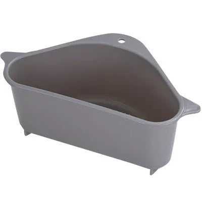 Beige plastic triangle sink storage rack for draining sponges, shown mounted on a kitchen faucet.
