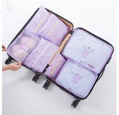 Durable waterproof packing cubes in various colors for organized, efficient travel