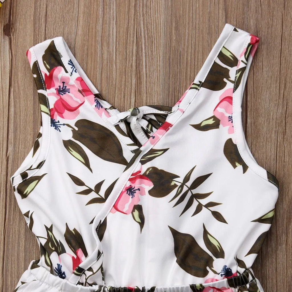 Baby girl wearing cotton floral summer outfit in white or yellow colour