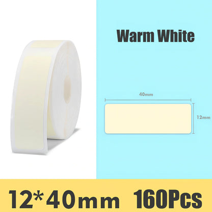 Pack of white D11 waterproof thermal label paper, 12x40mm size, showing clear printed text on resistant surface