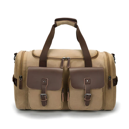 Medium canvas travel bag in black, 53x31x24cm with zipper top, double padded straps, waterproof canvas for 20-35L storage