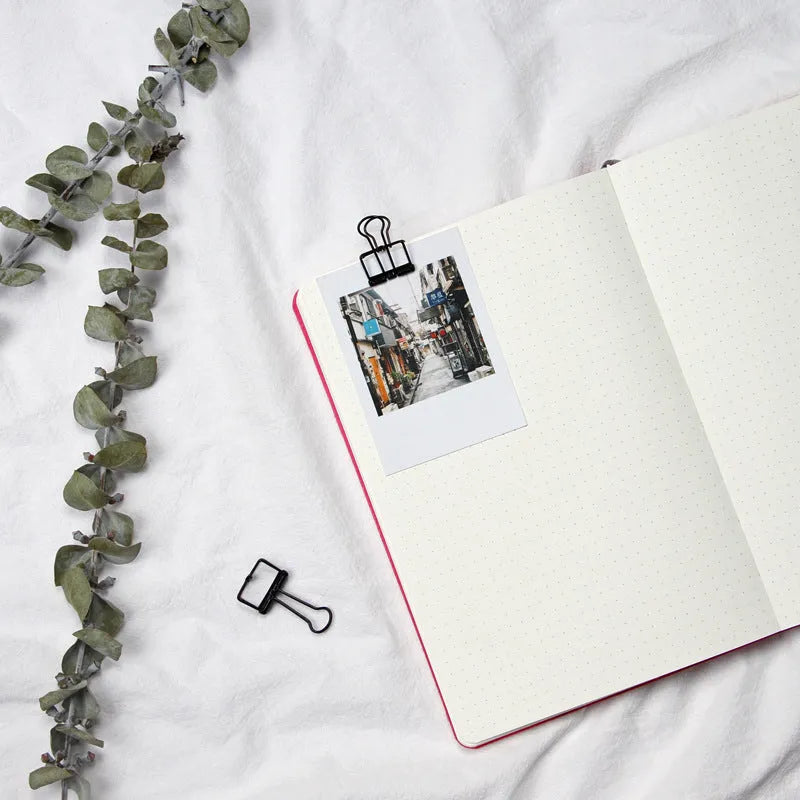 A5 dot grid notebook with soft blue imitation leather cover and locking plastic binding