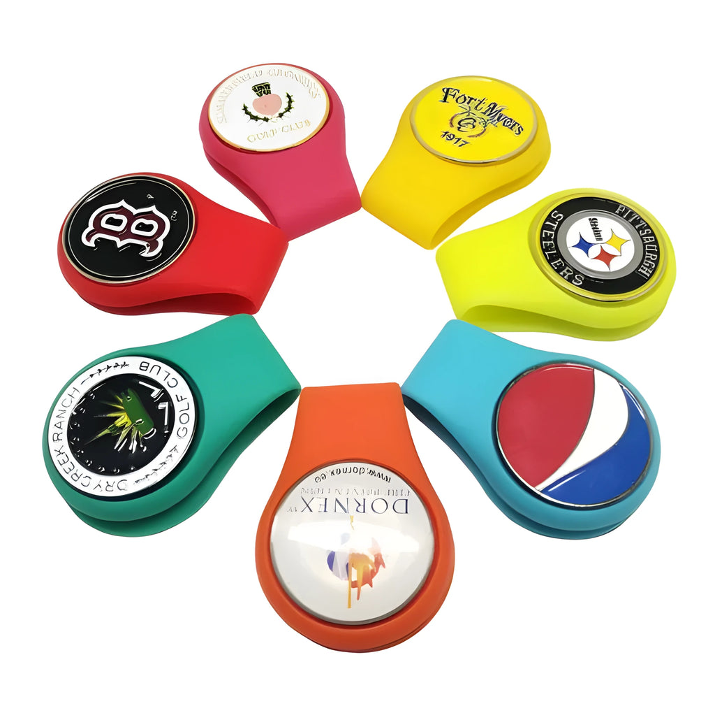 Set of 10 silicone golf hat clip ball marker holders in assorted colours attached to a hat brim