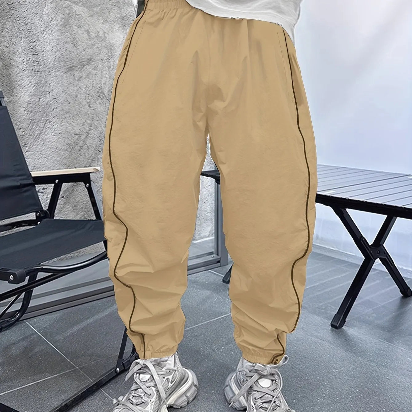 Men's loose fit cropped trousers in bamboo fibre, shown in army green colour.