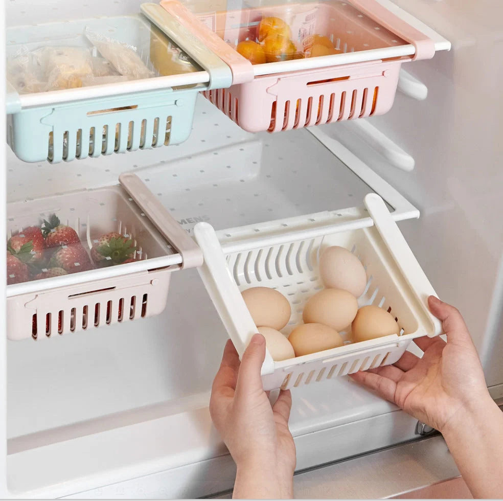 Stretchable refrigerator storage basket in white, blue, pink, and apricot colours