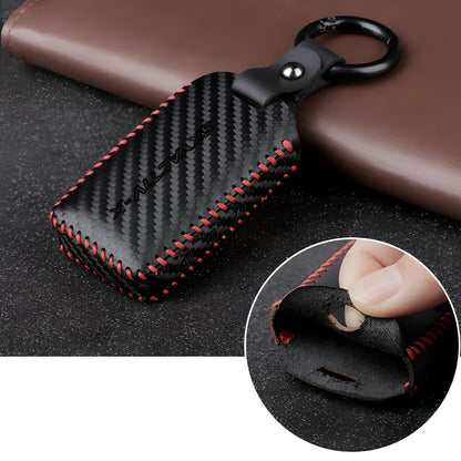 Black Angkesaila leather key case with 3D carbon fibre pattern and red stitching, 10 cm size for fob protection