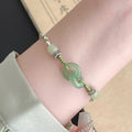 Jade peace buckle women's bracelet with double ring design in electroplated copper construction