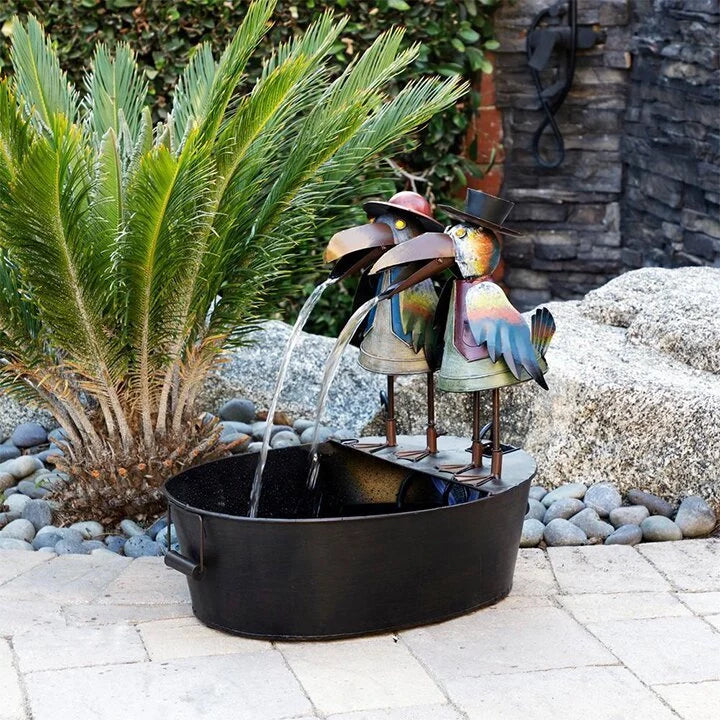 Handcrafted resin garden fountain with detailed crows and flowing water feature