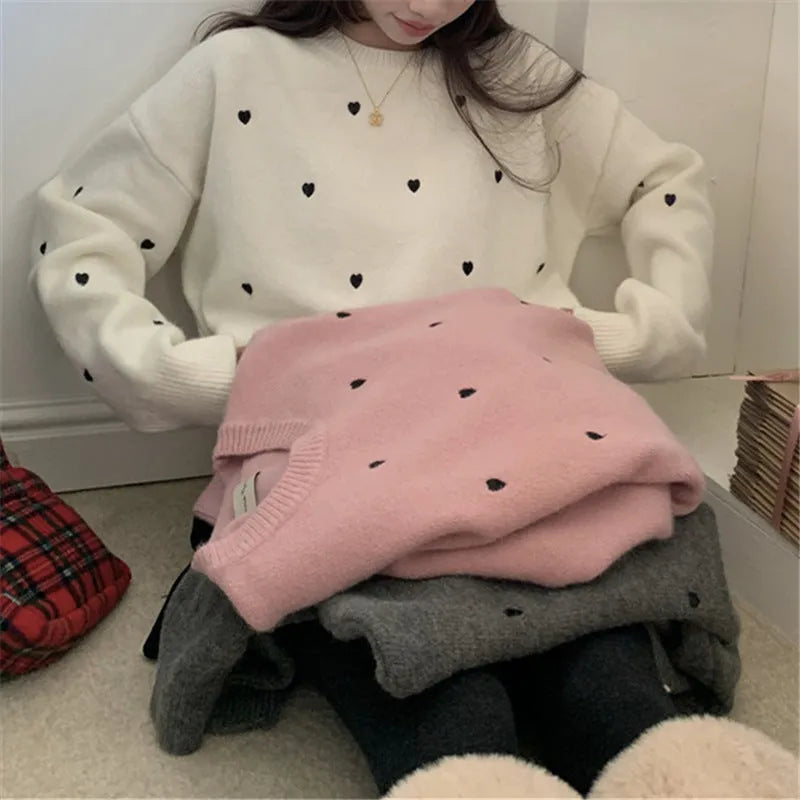 Beige loose-fit women's acrylic pullover sweater with long sleeves and chest embroidery.