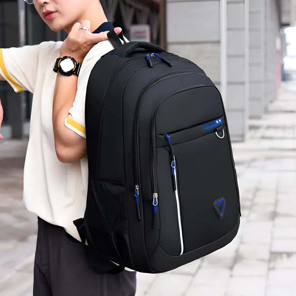 Men's Oxford cloth schoolbag with letter pattern design showing air pillow belt burden reduction system