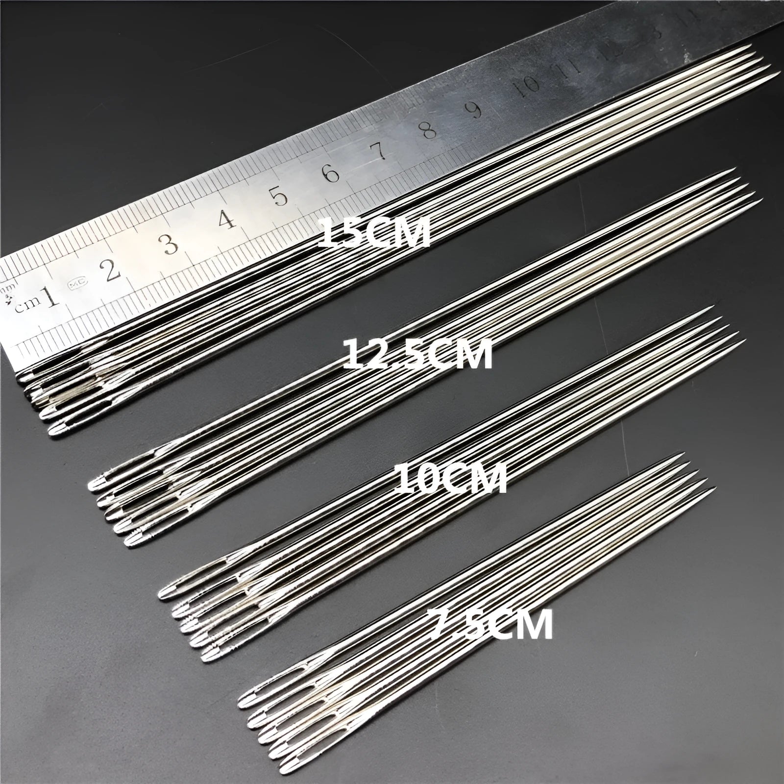 Set of five long steel sewing needles with 1.8mm body thickness and 7mm eye in a pack