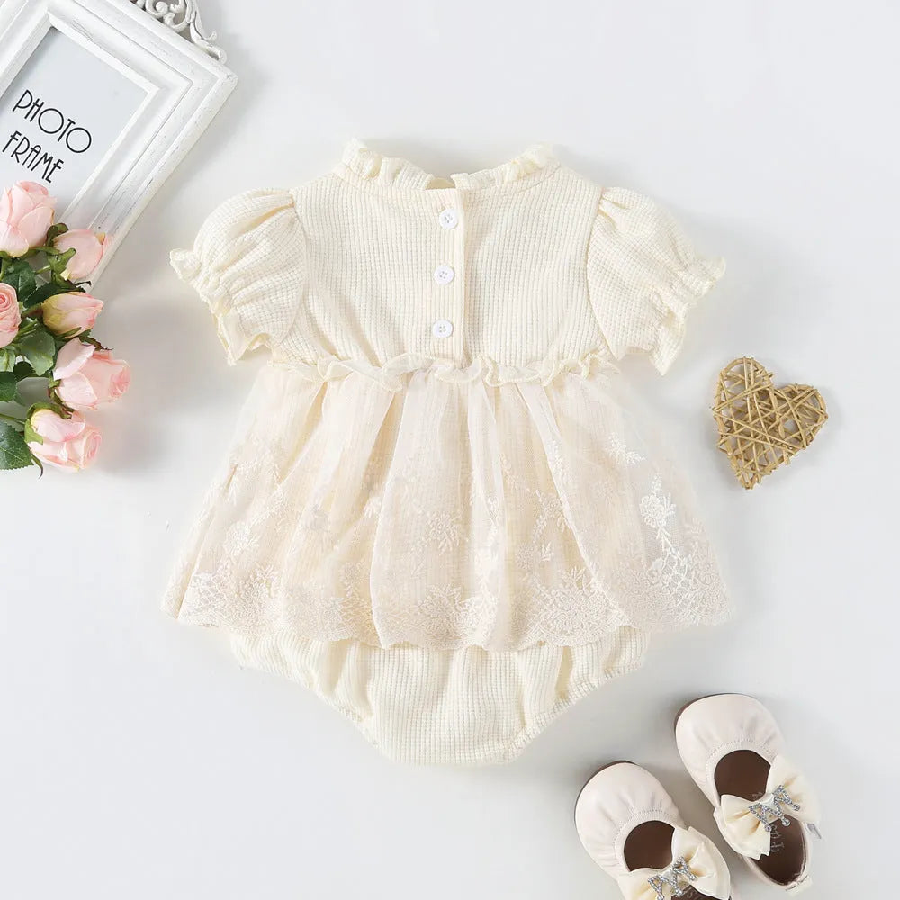Apricot cotton triangle jumpsuit for girls with short sleeves and single-breasted closure on a white background