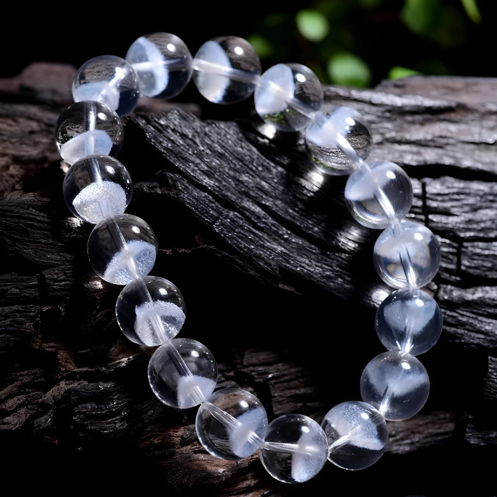 Women's adjustable white crystal bracelet with a pyramid bead and ruyi charm, shown on a wrist.