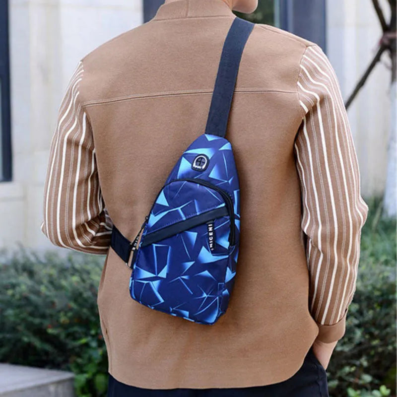 A blue print sling chest bag for men with an earphone hole, shown in a square vertical crossbody style.