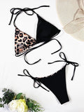 Women's leopard print halter bikini with lace-up front closure