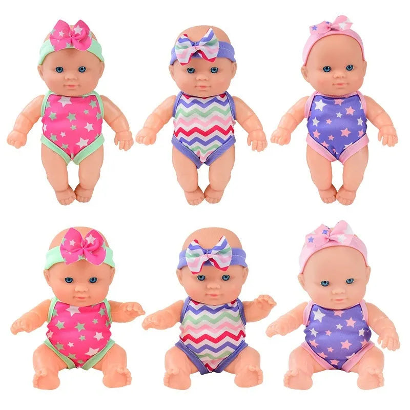 A detailed vinyl simulation baby figurine doll, showing its realistic features and proportions.