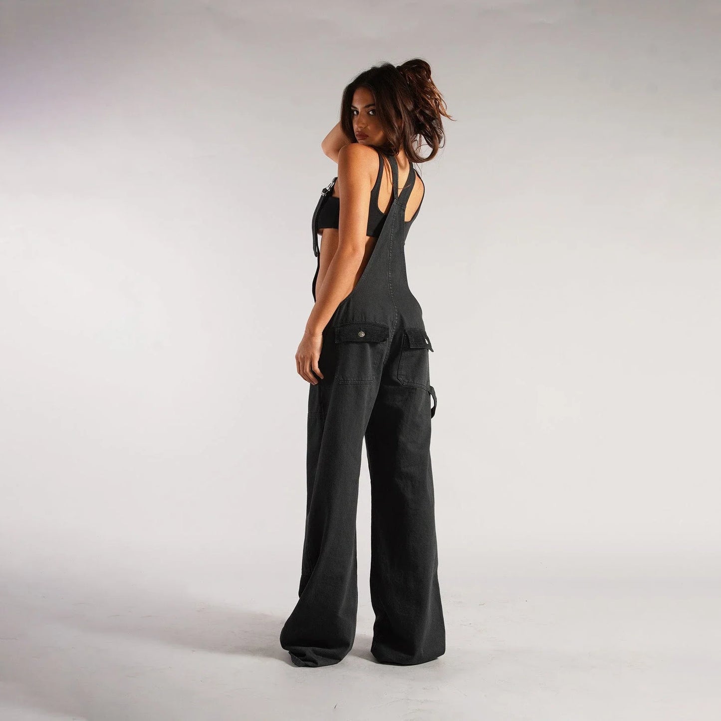 Trendy denim overalls with pockets, featuring a unique Y2K-inspired design, micro-elastic fit, and convenient layout for a stylish and comfortable streetwear look.