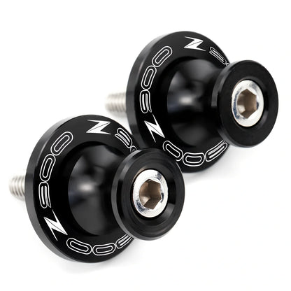 Pair of 8mm CNC aluminium swingarm spools sliders in titanium for Kawasaki Z650 Z900, with Delrin contact and stainless bolts