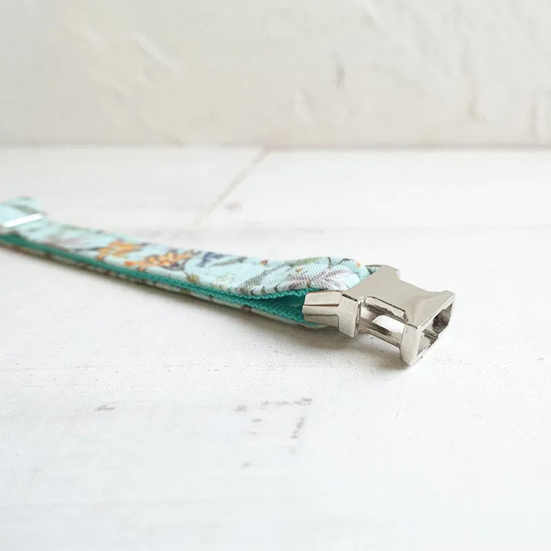 Green adjustable pet collar made from cloth and webbing suitable for dogs and cats with two sizes S and L