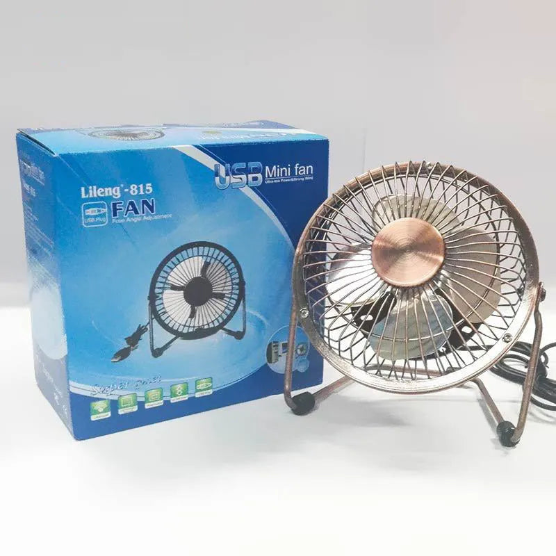 4-inch metal USB mini fan in bronze colour with rocker switch on desk