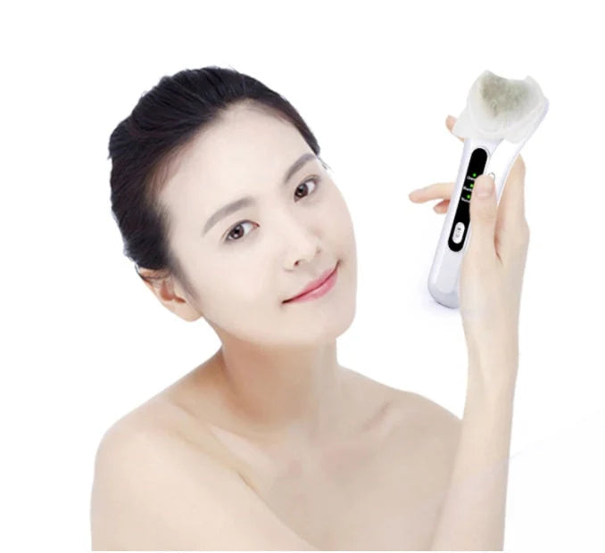 Electric Ultrasonic Facial Beauty Device in white, compact design for skincare