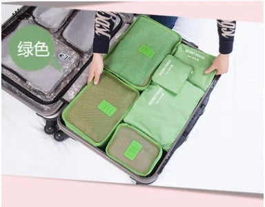 Durable waterproof packing cubes in various colors for organized, efficient travel