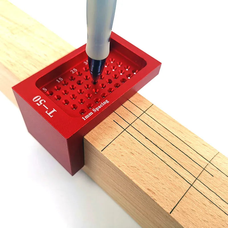 Red alloy steel T50 Mini Scribe woodworking ruler on a wooden workbench