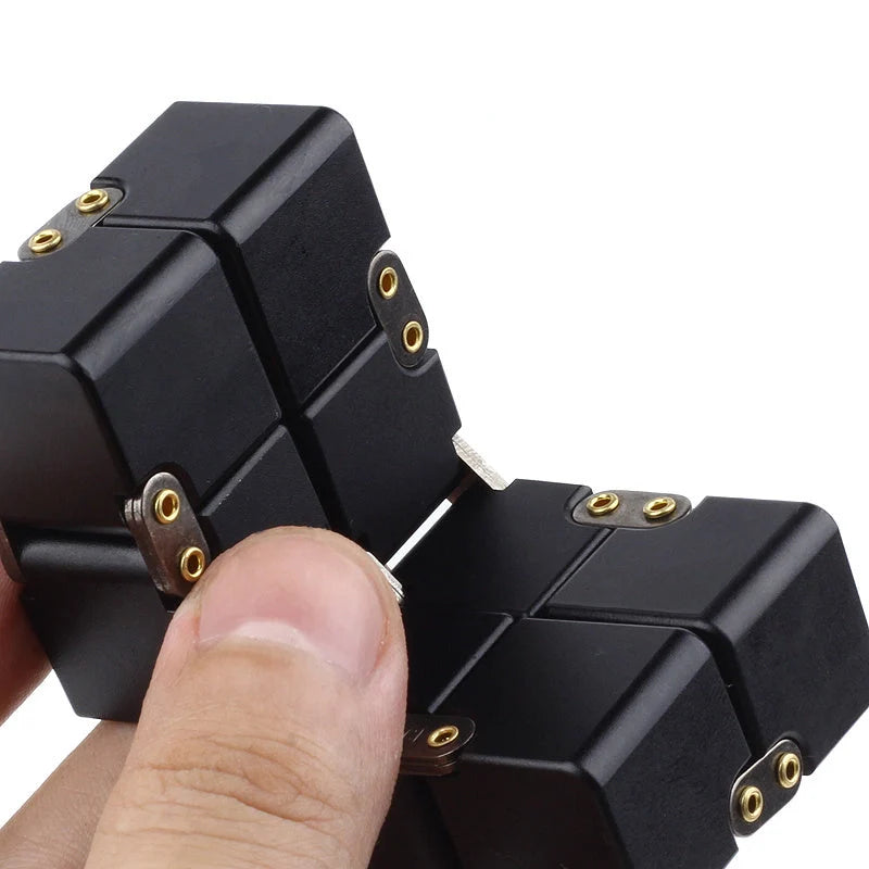 Infinity Cube Educational Toy in zinc alloy, available in multiple colours for focus enhancement and stress relief.