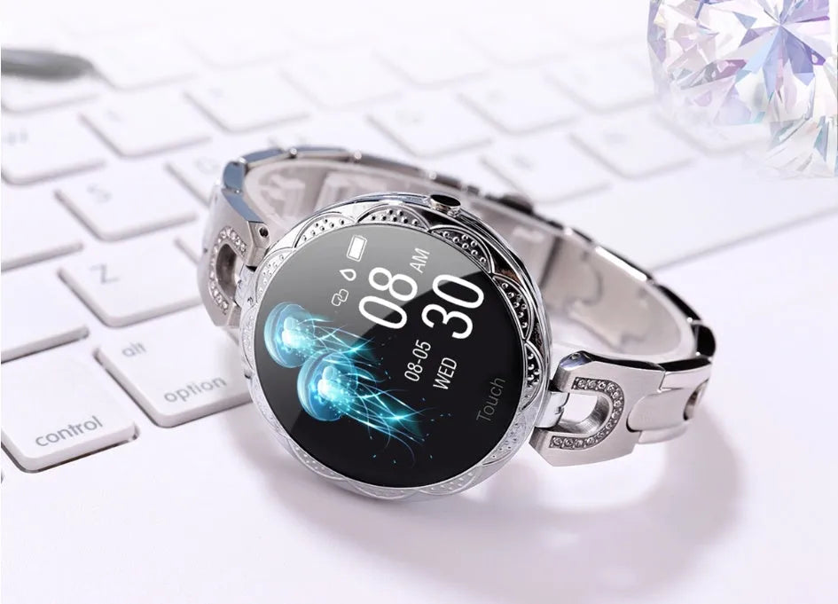 Fashion women's smart watch with round LCD screen and stainless steel strap in Rose Gold