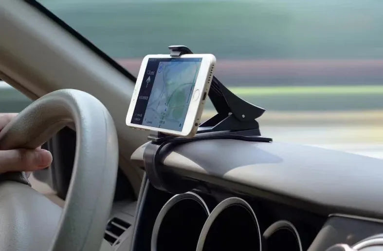 Black G-40 car bracket attached to steering wheel holding a mobile phone for navigation