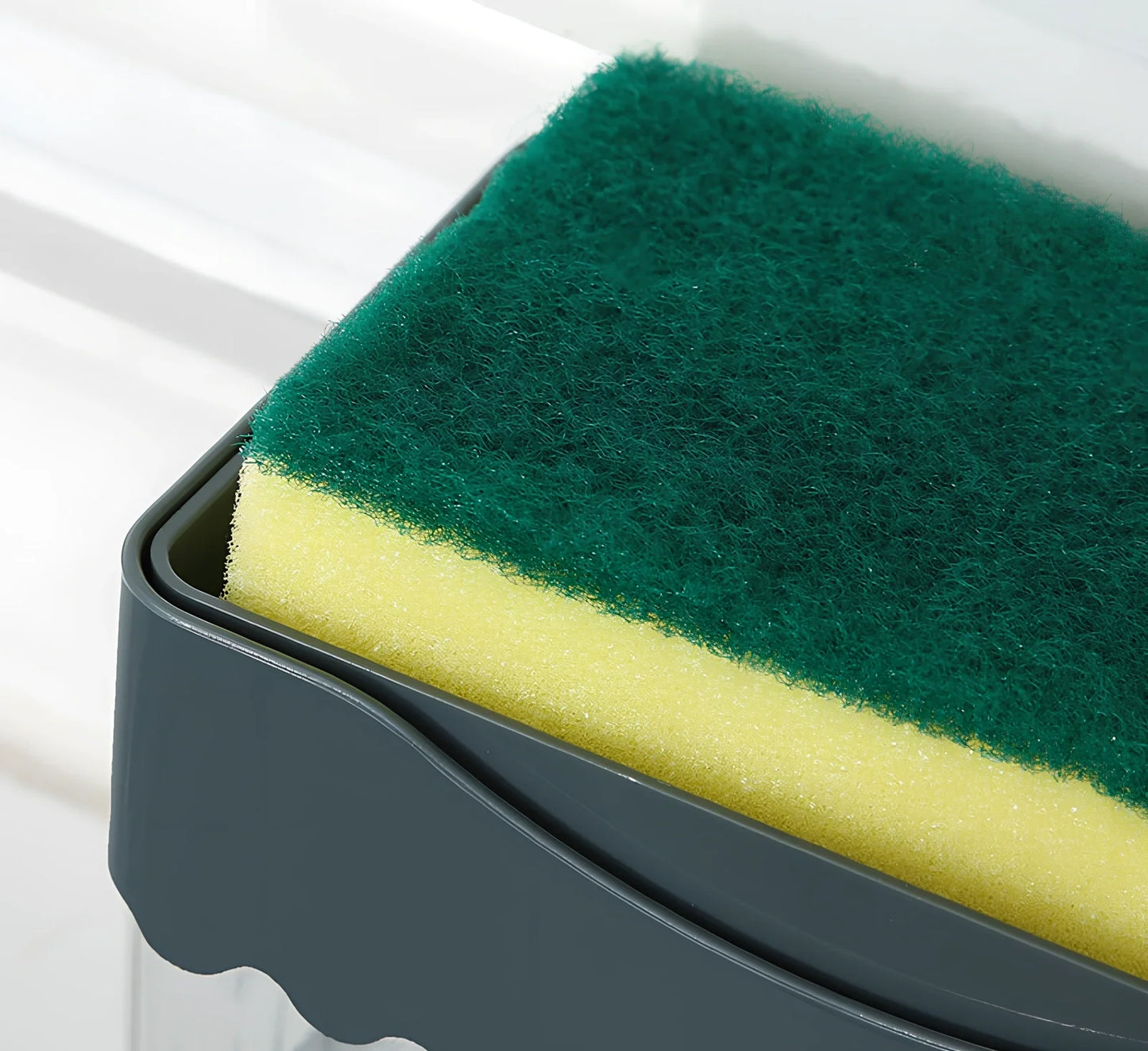 Dark blue 2-in-1 soap dispenser and sponge caddy unit on kitchen counter with measuring tape showing 13.5cm diameter