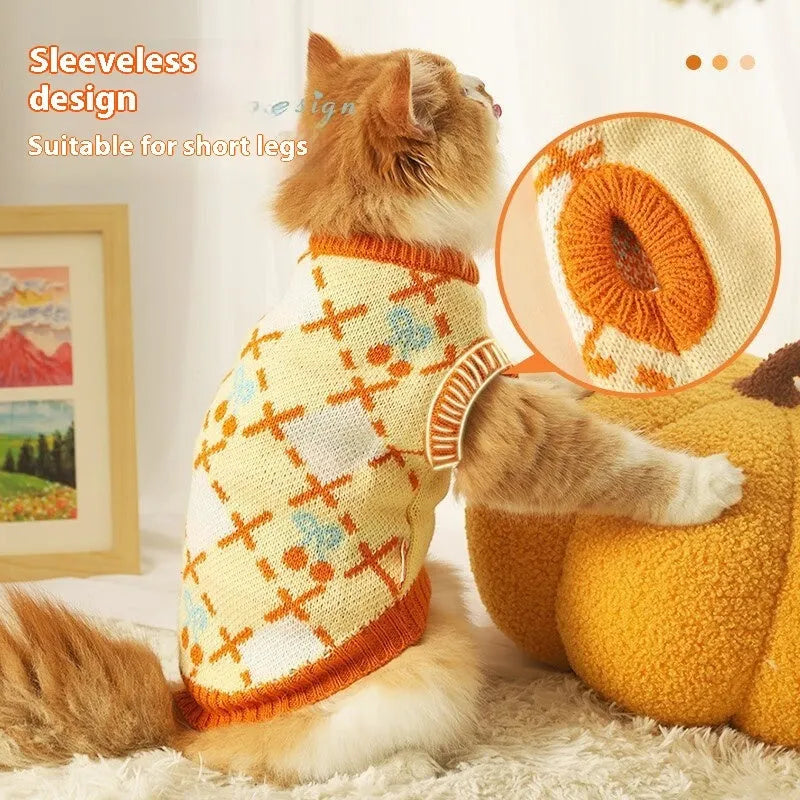 Orange cherry coloured thick knit cat sweater for autumn and winter, shown on a cat.